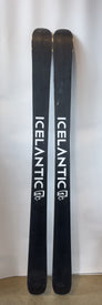 Two black Demo - 23/24 Nomad 95 skis from Icelantic stand upright side by side against a plain white background. The Icelantic logo is printed vertically in white on both all-mountain skis.