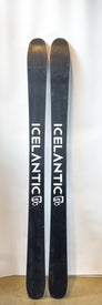 A pair of Demo - 23/24 Pioneer X skis by Icelantic stand upright against a white background, featuring the bold white brand name and logo on each ski. These versatile all-mountain skis offer top-tier performance for those seeking reliable demo equipment.