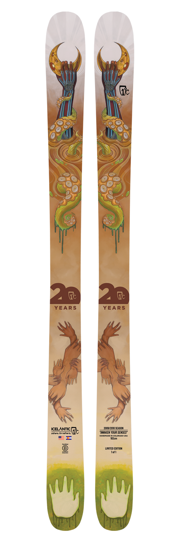 A pair of Icelantic 20 Yr 09/10 Nomad 106 all-mountain skis featuring a vibrant design with a snake winding around a staff, animal paws at the base, and special "20 years" anniversary marking for this limited edition release.