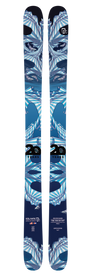 A pair of Icelantic 20 Yr 12/13 Nomad 106 skis in blue and white, featuring abstract geometric patterns with sharp lines, wave shapes, and special limited-edition text marking Icelantic’s 20th Anniversary. The all-mountain design prominently displays the Icelantic brand and “20 Years.”.