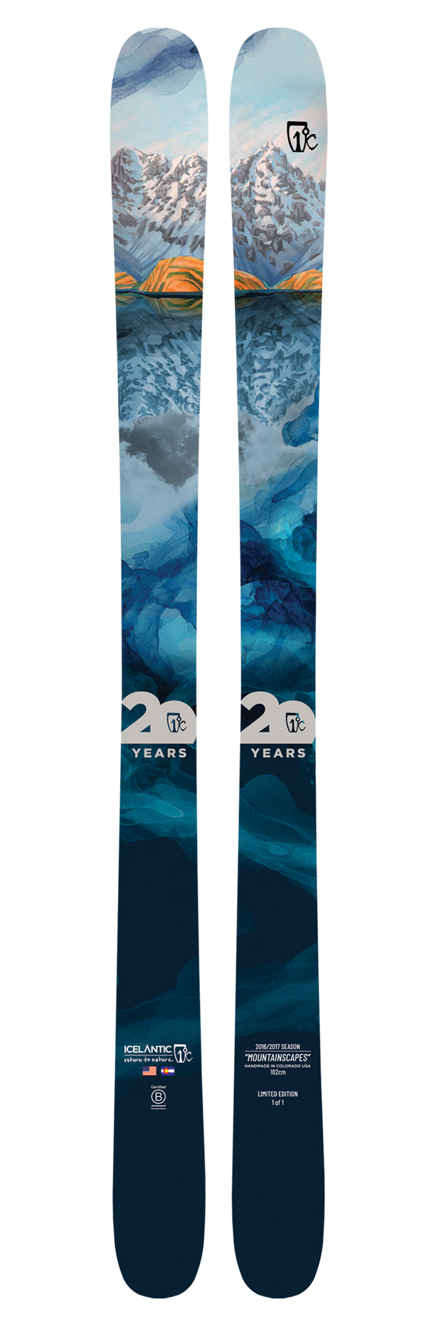 Introducing the 20 Yr 16/17 Nomad 106 from Icelantic—a pair of all-mountain skis featuring vibrant blue and orange brushstrokes with a snowy mountain landscape and rocky terrain artwork. Adorned with the Icelantic logo and “20 years” text, these skis are part of the exclusive Icelantic Top 20 Collection, celebrating the adventurous spirit of the Nomad 106.