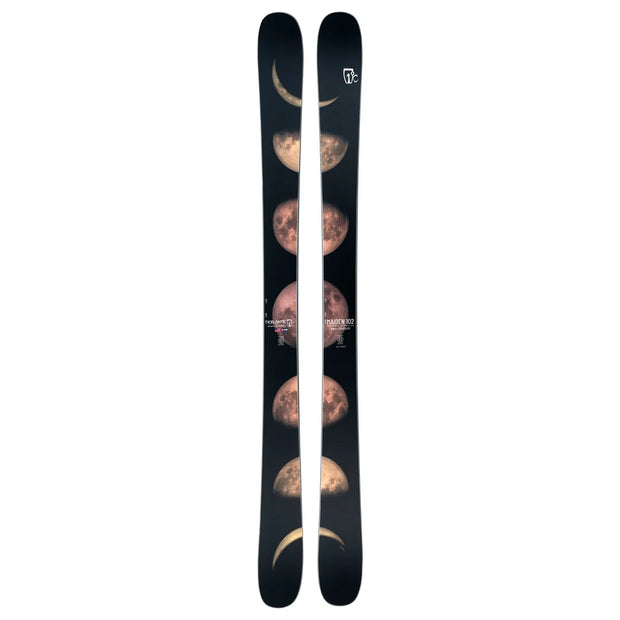A pair of Icelantic Skis Maiden 102, black in color, featuring a vertical graphic of the moon in its various phases along the length of each ski.