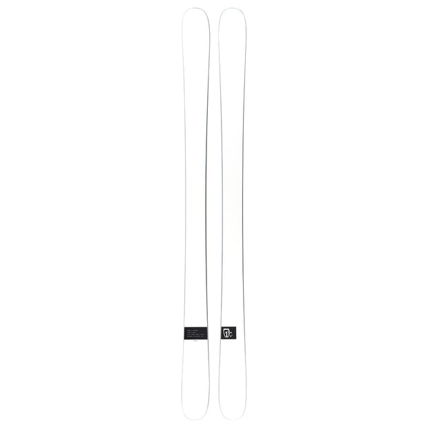 A pair of Icelantic Skis Nomad 94 Whiteout skis, featuring a white design with subtle black detailing in the center, displayed side by side on a plain white background.