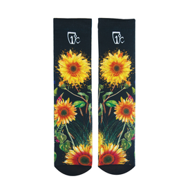 Introducing the Sunflower Nia Pro Socks by Icelantic—a pair of black crew-length lifestyle socks adorned with vibrant yellow sunflowers, green stems and leaves, and a white logo at the top of each sock, inspired by Travis Parr artwork.