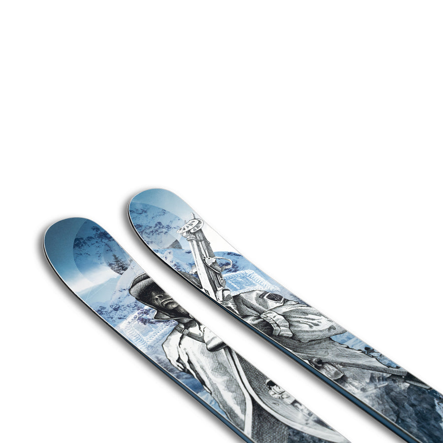 A close-up of two skis featuring an illustrated design of a skier holding ski poles against a snowy mountain landscape—this special edition 10th Mtn Nomad 100 from Icelantic Skis beautifully combines artistry and performance.