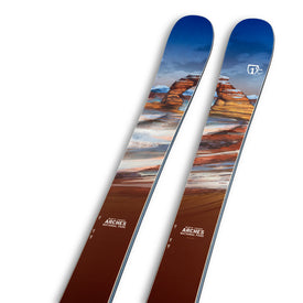 Introducing the Icelantic Skis Arches NP 100—a versatile pair of skis adorned with a desert landscape design inspired by Arches National Park, featuring blue skies, red rock formations, and white markings.