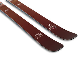 Two maroon-colored, versatile Arches NP 100 skis by Icelantic Skis, featuring the text “NP 100,” “ADVANCE PROJECT,” and “IDEAL LIFE” printed near the tips, displayed against a white background.