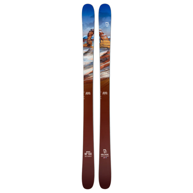 A pair of Icelantic Skis’ Arches NP 100 all-mountain skis, featuring a versatile design with blue sky at the tips, red rock formations along the length, and a gradient blend into brown towards the base.