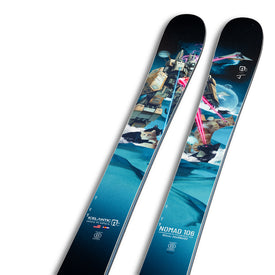 A pair of blue J Skis x Icelantic Nomad 106 skis from Icelantic Skis, featuring vibrant, futuristic robot artwork set against a snowy mountain landscape—ideal for freeride enthusiasts looking for playful performance both on and off the beaten path.