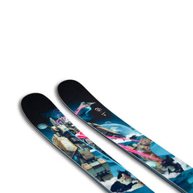 Close-up of two J Skis x Icey Nomad 106 skis by Icelantic Skis, featuring a vibrant blue and black graphic design with playful cats, spaceships, and laser beams—the perfect ski for freeride adventures.