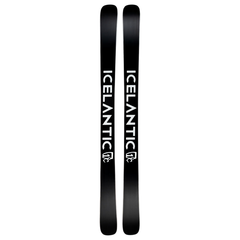 A pair of black Icelantic Skis Nomad 100 skis featuring bold white “ICELANTIC” lettering and a small white mountain logo near the tails, displayed side by side.