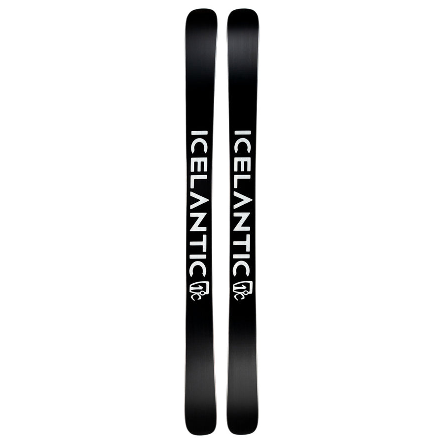 A pair of black Icelantic Skis Nomad 100 skis featuring bold white “ICELANTIC” lettering and a small white mountain logo near the tails, displayed side by side.