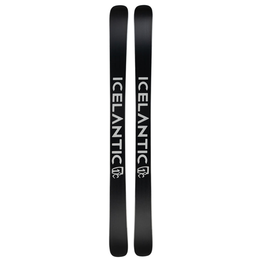A pair of Rocky Mtn NP 100 all-mountain skis by Icelantic Skis, featuring a sleek black design with the brand name ICELANTIC in bold white lettering along each ski and a subtle white logo near the base—handmade in Colorado for outstanding quality and performance.
