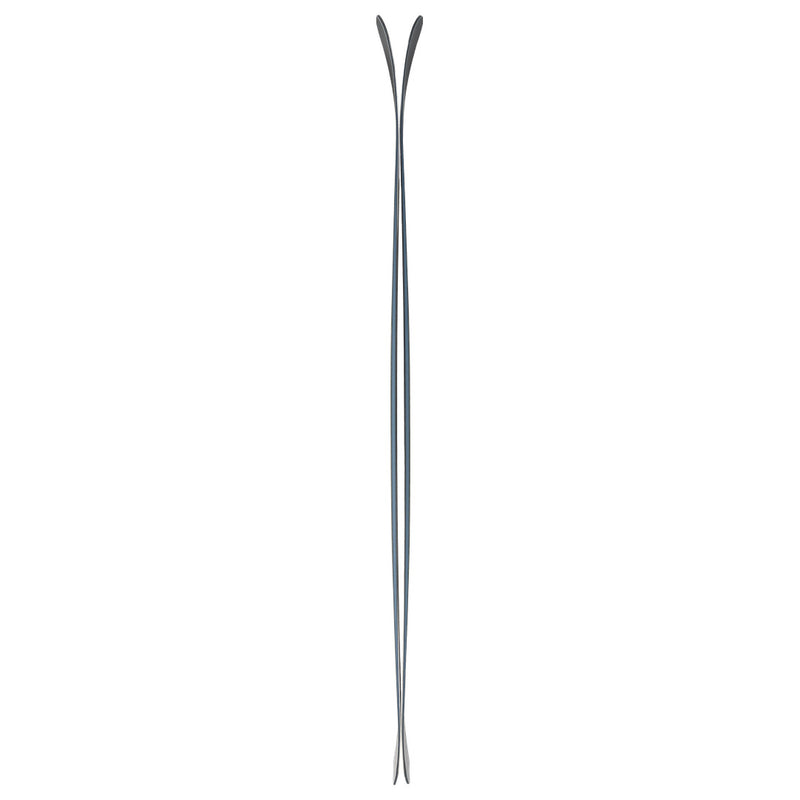 A side view of two Icelantic Shaman 110 alpine skis standing vertically, with tips curving slightly outward and tails close together, highlights the thin and cambered profile of these 110mm waist skis designed for impressive carving performance.