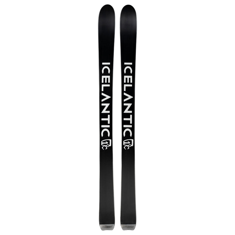 A pair of Icelantic Shaman 99 skis in black, each featuring the brand name “ICELANTIC” in bold white letters with a white logo beneath the text, are displayed vertically side by side against a white background. These all-mountain skis are expertly crafted by Icelantic to provide versatile performance across a range of terrain.