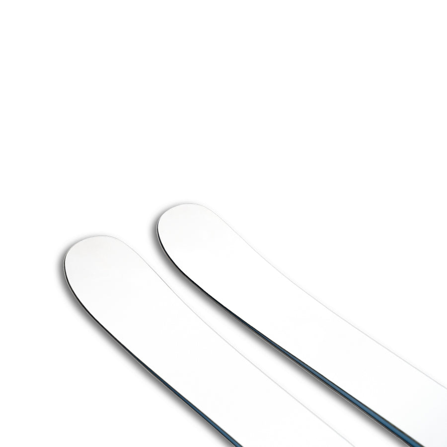 Two Icelantic Skis Nomad 112 Whiteout freeride skis with slightly rounded tips, positioned side by side on a white background, are shown. The image is minimalistic, with only the top portions of these advanced skis visible—perfect for advanced skiers seeking precision and performance.