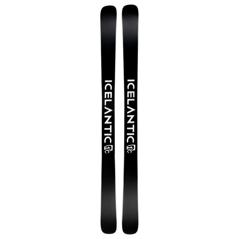 A pair of Icelantic Skis Nomad 94 black skis, featuring the word “ICELANTIC” in bold white letters running down the length of each ski, positioned side by side with their tops and bottoms aligned.