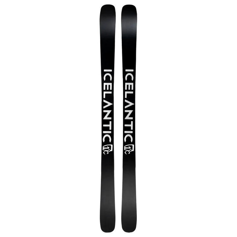 A pair of black Torrent 96 skis by Icelantic Skis are placed side by side, each featuring the word ICELANTIC in bold white lettering down the length and a small logo near the bottom.
