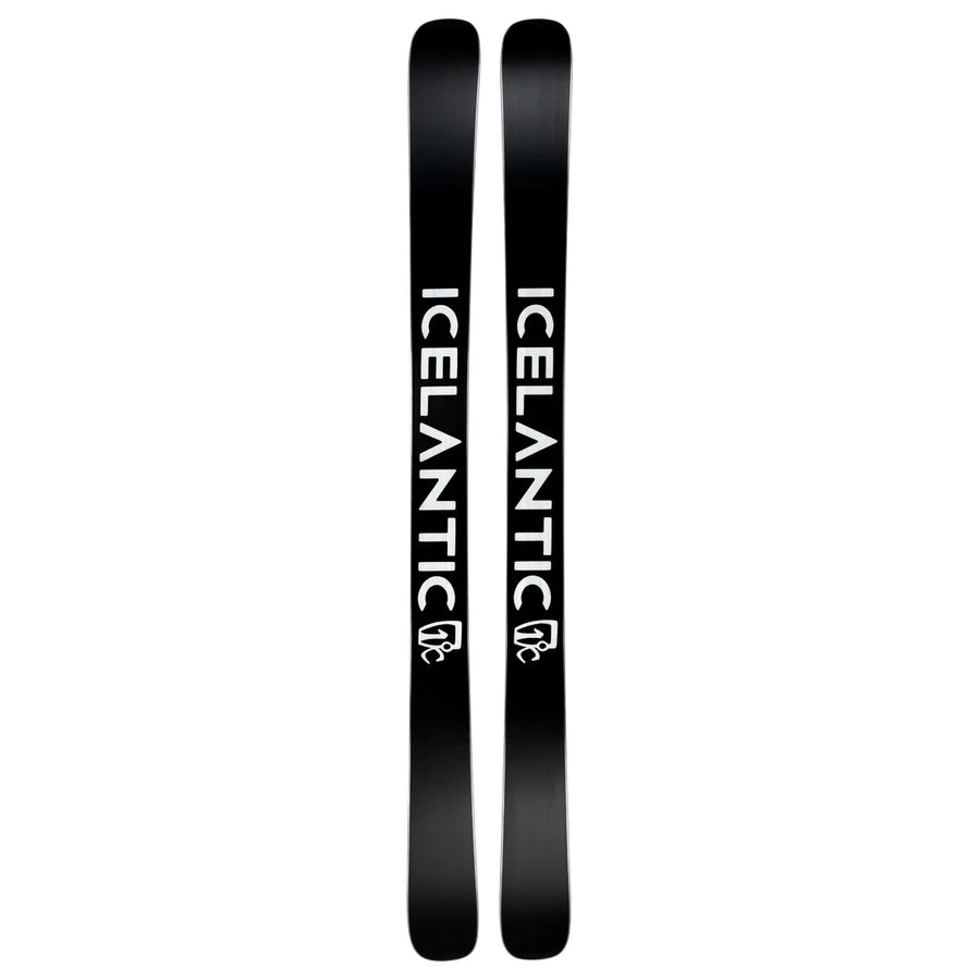 A pair of black Icelantic Skis Nomad 100 Whiteout, each featuring the word “ICELANTIC” in bold, white, vertical letters and a small logo near the bottom.