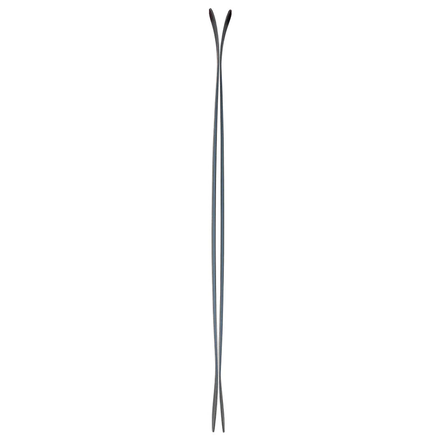 A pair of Icelantic Skis Torrent 102 crossed and viewed from the side, displaying their narrow waist with wider tips and tails, as well as the distinctive upward curve of both the ski tips and tails.