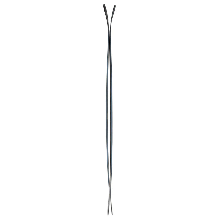 A pair of Icelantic Skis Torrent 96 in black and silver are positioned upright back to back, viewed from the side, showcasing their curvature and slim profile against a white background.