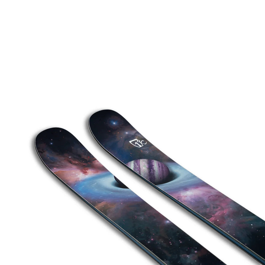 The Icelantic Skis Maiden 108 is a pair of skis with a colorful space-themed design, featuring planets, stars, and galaxies on a white background.