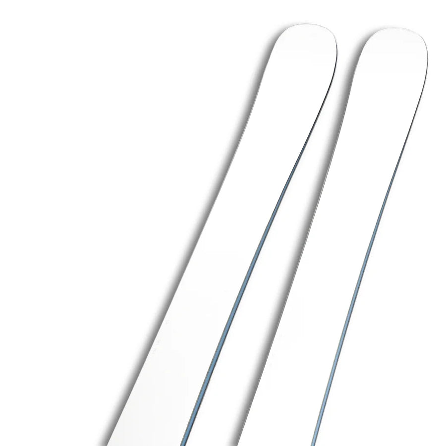 A close-up of the top halves of two Icelantic Skis Nomad 100 Whiteout skis set against a white background, highlighting their slightly curved tips and clean design.