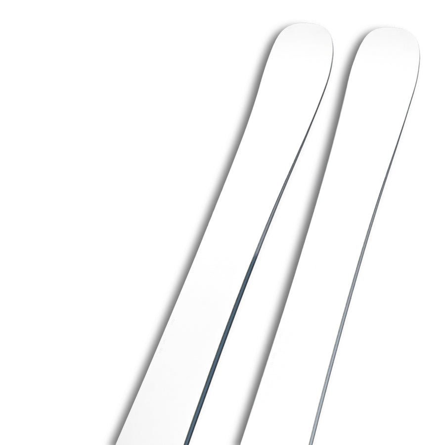 Two Icelantic Skis Nomad 94 Whiteout skis with rounded tips are shown diagonally on a plain white background, with only the upper sections visible.