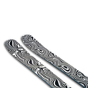 Two Icelantic Skis Torrent 96 Proto skis, featuring a bold black and white abstract swirl pattern on their topsheets, are photographed against a white background.