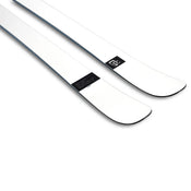 A pair of Icelantic Skis Nomad 100 Whiteout, featuring a sleek white design with black edges and a small black logo near the tips, photographed on a white background.