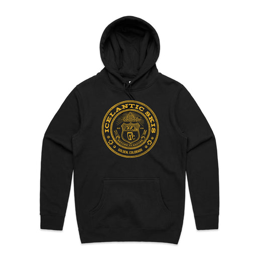 The Colorado Seal Hoodie by Icelantic Skis is a black, hooded sweatshirt showcasing a large circular gold emblem on the chest with “Icelantic Skis” and “Golden, Colorado,” along with a central mountain and ski logo. This sustainable hoodie is designed for both comfort and style.