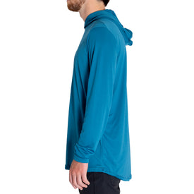 A person wearing the Icelantic UV Sun Hoodie in Celestial Teal stands in profile facing left against a white background. Only their upper body is visible, with the face partially out of frame. This long-sleeve hoodie provides UPF 50 sun protection and quick-dry performance for superior style and coverage.