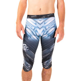 A model wears the Icelantic 23/24 Mens WikMax Baselayer 3/4 Bottom, featuring knee-length compression fit and a geometric blue, white, and black pattern. Made from advanced WikMax fabric, these bottoms include a black waistband with the Icelantic logo and a white Icelantic logo on the right thigh. Set against a white background.
