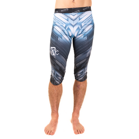 A barefoot person is shown from the waist down, wearing Icelantic's 23/24 Mens WikMax Baselayer 3/4 Bottom compression capri leggings in a black, white, and blue pattern, photographed against a white background.