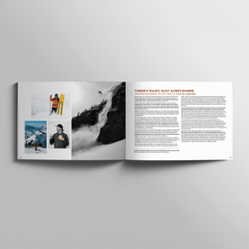 An open magazine displays black-and-white and color photos of skiers on the left page and an article titled "THERE'S MAGIC DUST EVERYWHERE" with text on the right, perfectly capturing the adventurous spirit celebrated in Icelantic Skis’ One Degree Celsius: 20 Years of Icelantic.