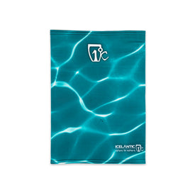 A blue 23/24 Shaman Facemask by Icelantic, featuring a sunlight-on-water design and white Icelantic logos at the top and bottom. This facemask offers UPF 50+ protection, making it an ideal ski mask for sunny days on the mountain.