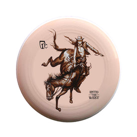 A tan Cowgirl Frisbee from Icelantic Skis featuring Travis Parr artwork—a dynamic illustration of a cowboy riding a bucking horse with the words INTO THE WEST boldly printed on it.
