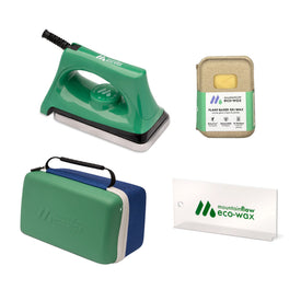 The Icelantic Skis mountainFLOW Eco Wax Kit includes a green iron, plant-based ski wax, biodegradable snowboard wax, plastic scraper, and a zippered carrying case—all displaying the “mountainFLOW eco-wax” logo.