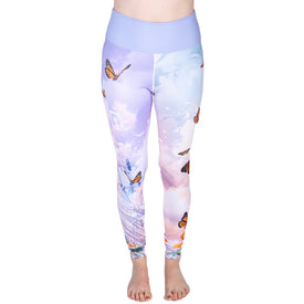 Person wearing pastel purple 22/23 Maiden Legging by Icelantic, featuring a butterfly print and a high-waisted waistband, standing barefoot against a white background. Only the lower body is visible.