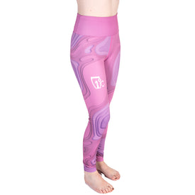 A person is wearing Icelantic 22/23 Mystic Leggings, featuring a high-waisted design, pink and purple patterns, Hyper Wiking WIKMAX Fabric for comfort, and a white Icelantic logo on the upper thigh, while standing barefoot against a white background.