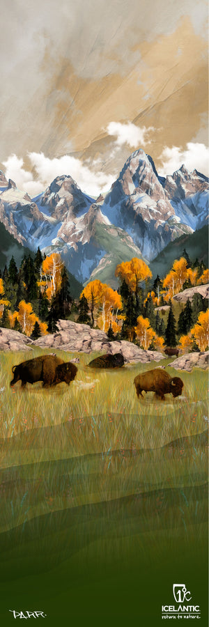 Bison roam a lush field beneath autumnal trees and towering, snow-capped peaks in the Grand Teton Fine Art Print by Icelantic Skis, perfectly capturing a stunning scene under a dramatic sky—ideal for elevating any art collection.