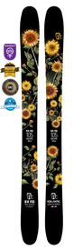 A pair of black Icelantic 22/23 Nia Pro 105 handmade skis from Colorado, showcasing vibrant yellow flowers and lush greenery in the design, with several award badges displayed above, including Women’s Specific and Best Ski Design honors.
