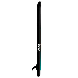 The Ionic X Parr Paddleboard - All Water Black by Icelantic Skis features a sleek black design with a white "ionic" logo displayed on the side. It boasts a curved tip, slim blue edging, and a single fin underneath—making it the perfect all water paddle board.