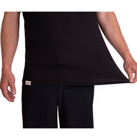 A person wearing the Icelantic Skis SoftTECH T - Black and matching pants stretches the side of their shirt outward, showcasing the fabric's flexibility. Only their torso and arms are visible, emphasizing the advanced wicking properties of the SoftTECH T that keep them cool and dry.
