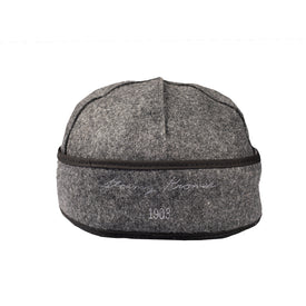 A gray Icelantic Stormy Kromer Cap with a black band around the edge, featuring white embroidered text that reads Henry Hoover 1903 on the front.