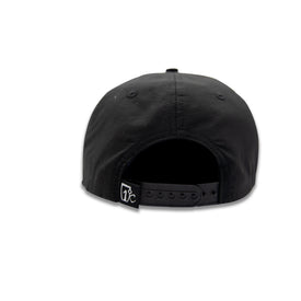 The Hey Girl Nylon Hat by Icelantic Skis is a black baseball cap shown from the back, featuring a snapback closure and a small white logo tag on the adjustable strap—an ideal summer accessory for sunny days.