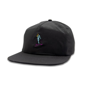 Introducing the Hey Girl Nylon Hat by Icelantic Skis—a black snapback cap featuring a unique, embroidered graphic on the front: a small figure in a light blue suit and purple shoes riding a purple skateboard. This standout summer accessory showcases Icelantic Skis’ original Hey Girl artwork, making it the perfect choice for sunny days.